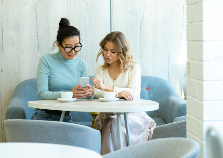 Women working over coffee